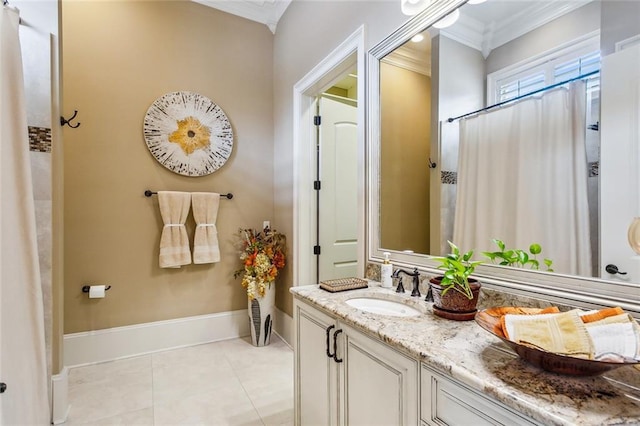 bathroom featuring tile patterned flooring, ornamental molding, and vanity