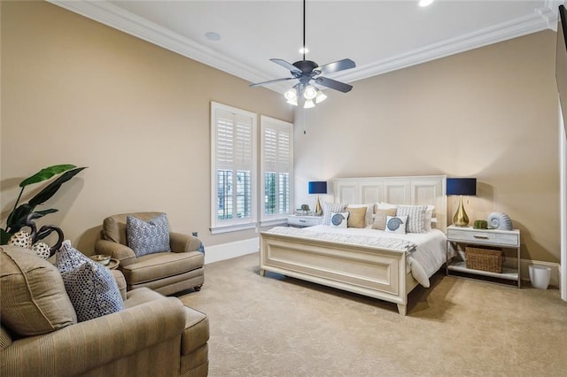 carpeted bedroom featuring ceiling fan and ornamental molding