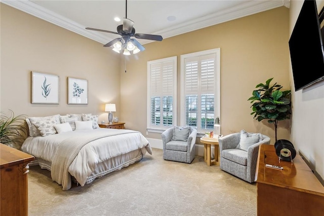 bedroom featuring crown molding, light carpet, and ceiling fan