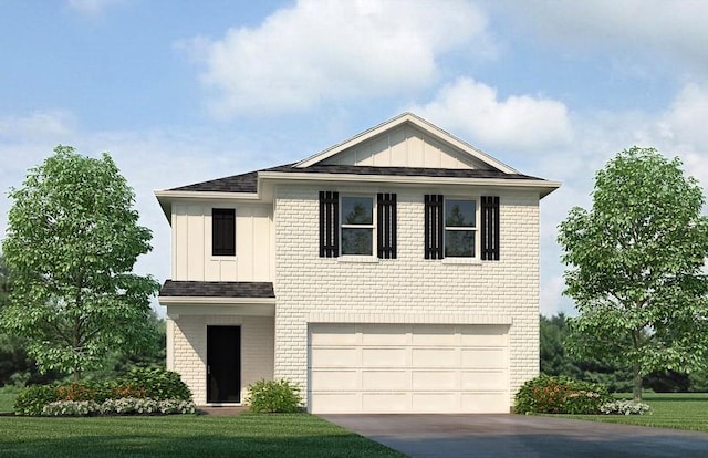 view of front of house featuring a garage and a front lawn