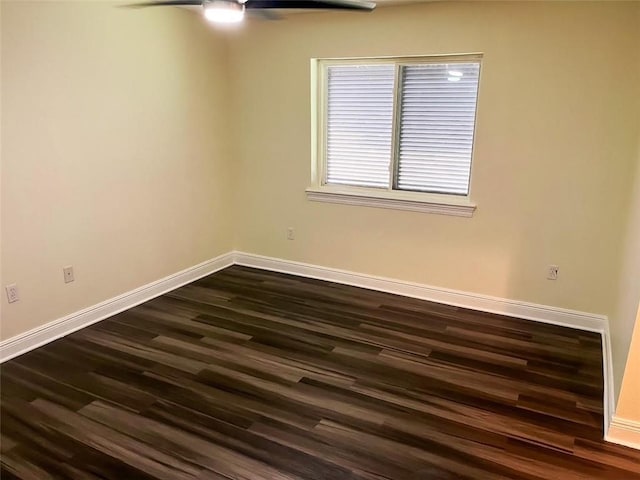 unfurnished room with dark hardwood / wood-style floors and ceiling fan