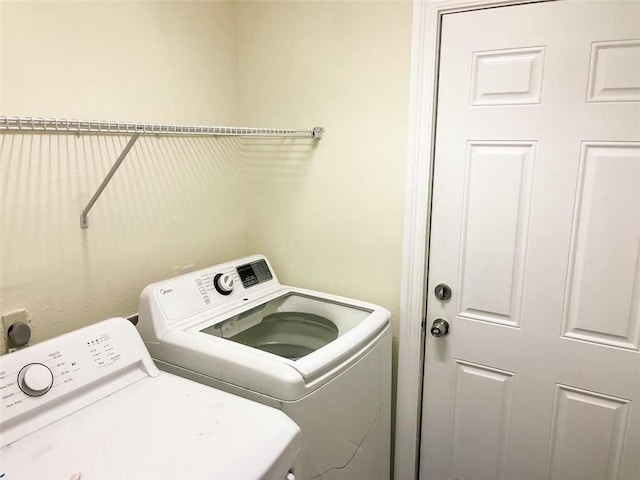 laundry area featuring washing machine and clothes dryer