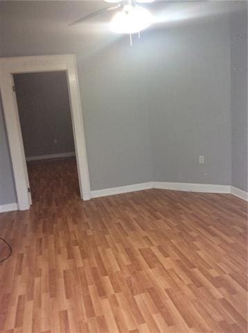 716-718 Delery St, New Orleans, LA 70117 - unfurnished room with light wood finished floors, baseboards, and a ceiling fan
