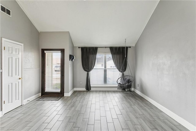 unfurnished room featuring crown molding