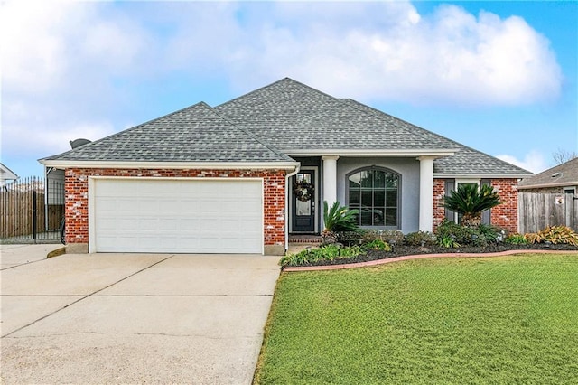 ranch-style home featuring a garage and a front lawn