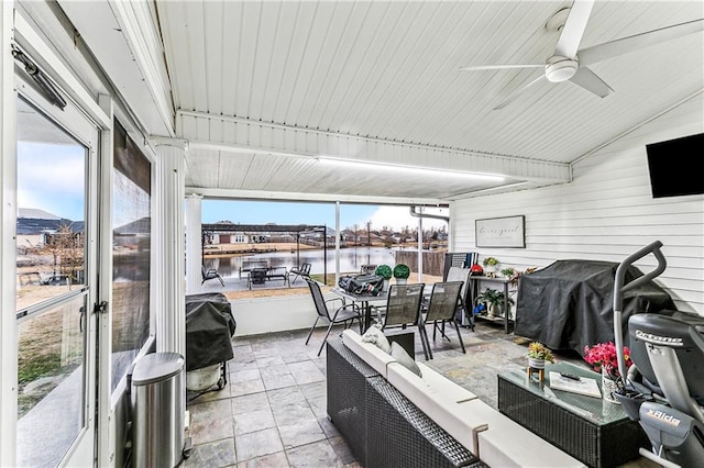 sunroom / solarium with lofted ceiling, a mountain view, and ceiling fan