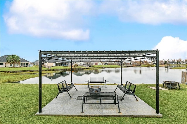 view of patio featuring a water view and an outdoor fire pit