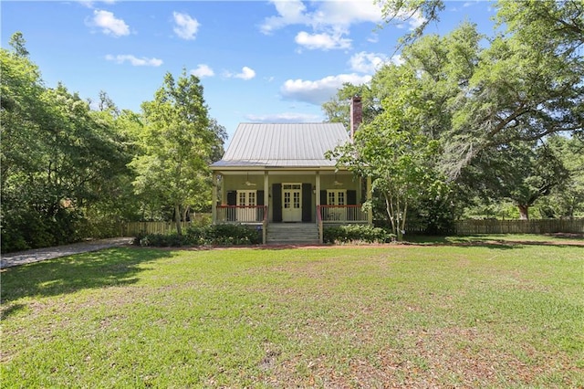 view of front of house featuring covered porch and a front lawn