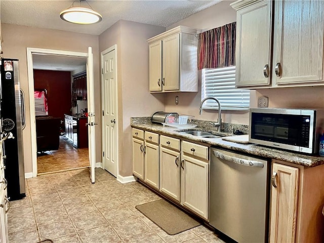 interior space featuring sink, decorative light fixtures, and a textured ceiling