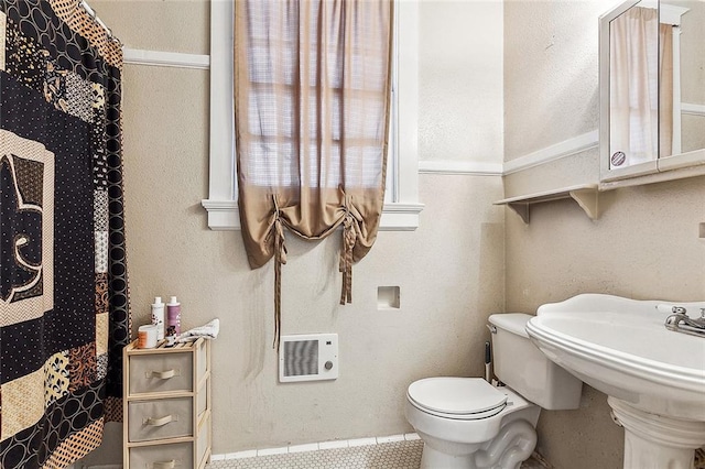 bathroom with toilet and sink