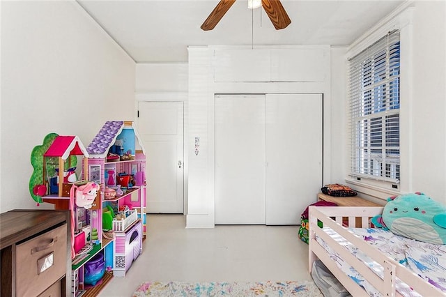 bedroom featuring ceiling fan and a closet