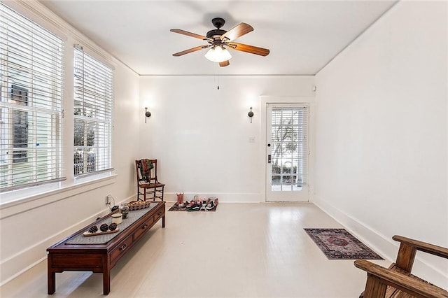 living area with light hardwood / wood-style flooring and ceiling fan