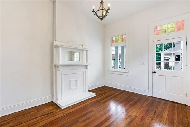 interior space with dark hardwood / wood-style floors and a chandelier