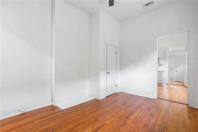 spare room with wood-type flooring