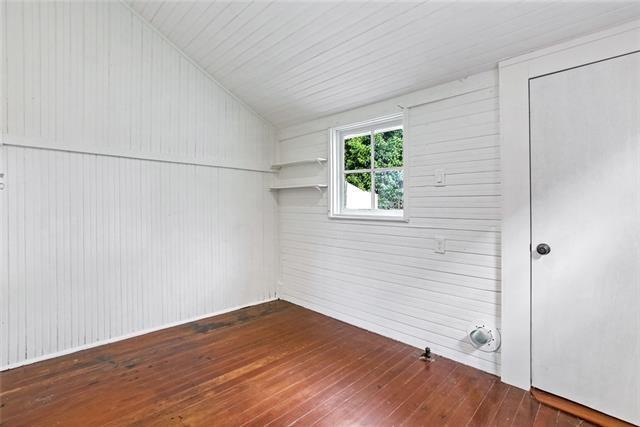 interior space with vaulted ceiling and dark wood-type flooring