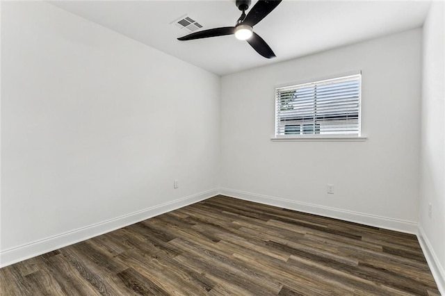 unfurnished room with dark hardwood / wood-style floors and ceiling fan