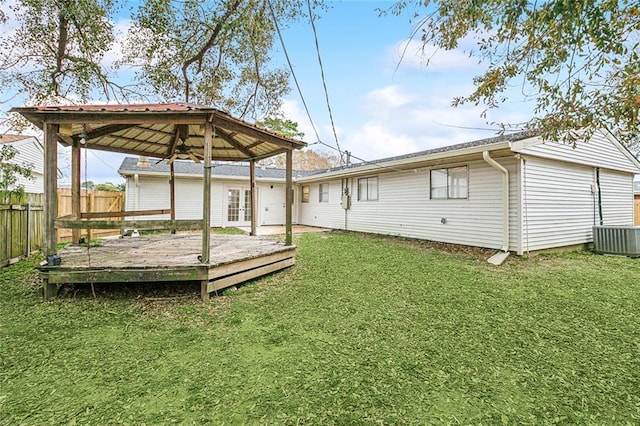 exterior space with a wooden deck, a gazebo, and central air condition unit