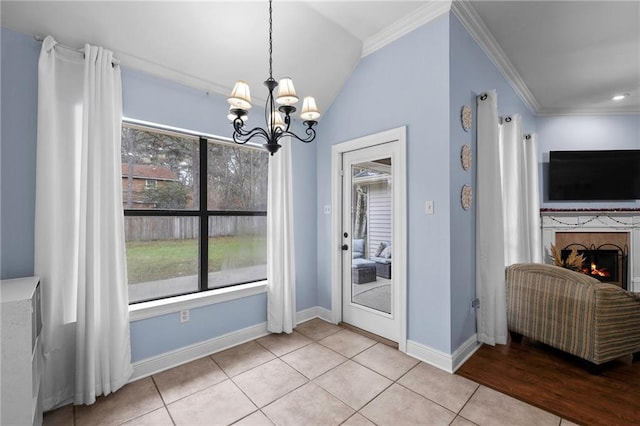 unfurnished dining area featuring crown molding, lofted ceiling, light tile patterned floors, and a notable chandelier