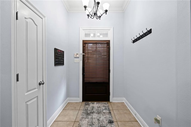 entryway featuring ornamental molding, light tile patterned floors, and a chandelier