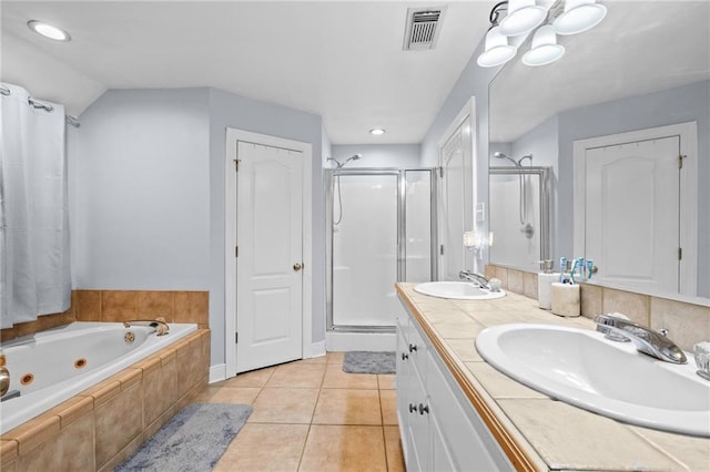 bathroom with vanity, independent shower and bath, and tile patterned flooring