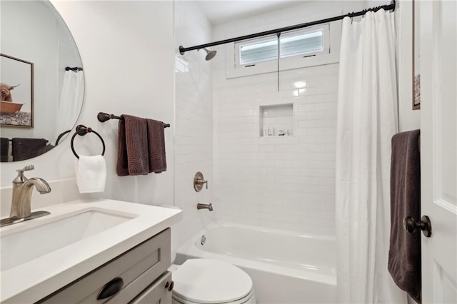 full bathroom featuring vanity, toilet, and shower / tub combo with curtain