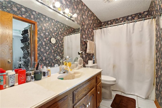bathroom featuring tile patterned floors, vanity, a textured ceiling, and wallpapered walls