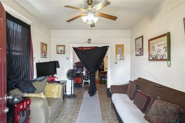 living area with ceiling fan