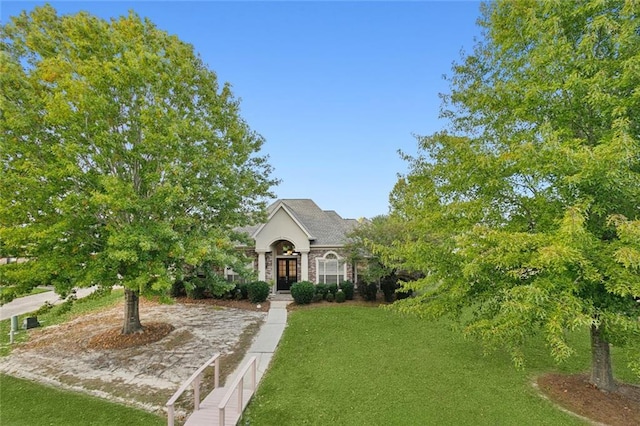 obstructed view of property featuring a front lawn