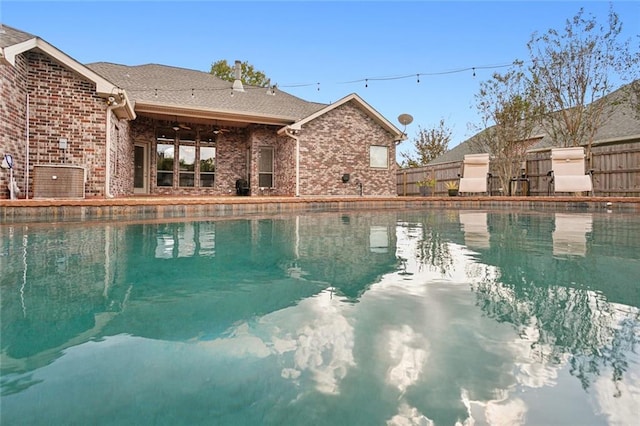 view of swimming pool featuring a fenced in pool and fence