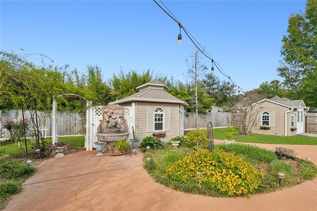 view of pool with an outbuilding and a patio area