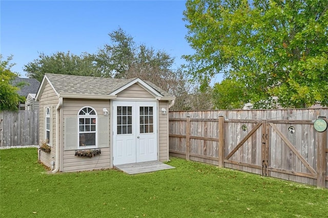 view of outbuilding with a lawn