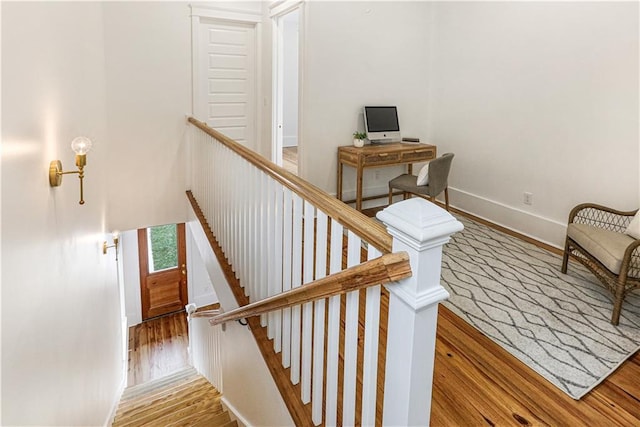 stairway featuring hardwood / wood-style floors