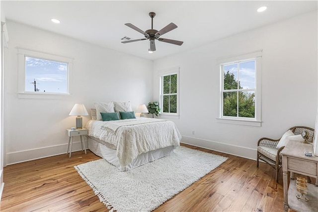 bedroom featuring wood-type flooring and ceiling fan