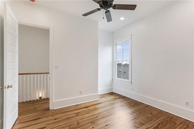 spare room with ceiling fan and light hardwood / wood-style floors