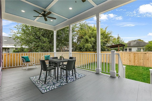 wooden deck featuring ceiling fan