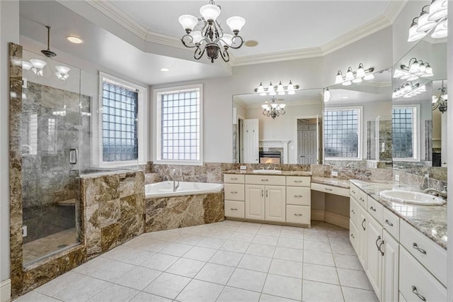 bathroom with crown molding, separate shower and tub, vanity, tile patterned floors, and a chandelier