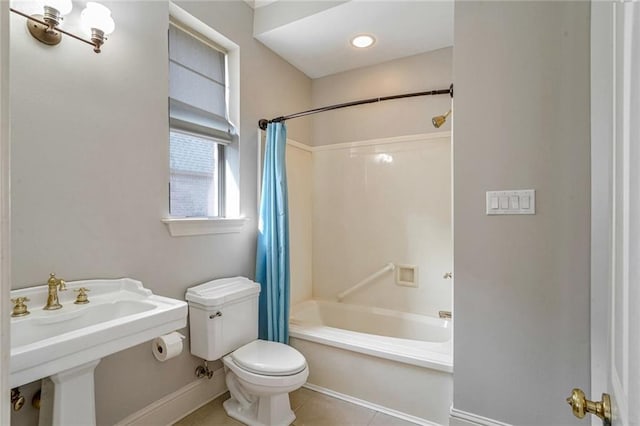 full bathroom with shower / bathtub combination with curtain, sink, tile patterned floors, and toilet