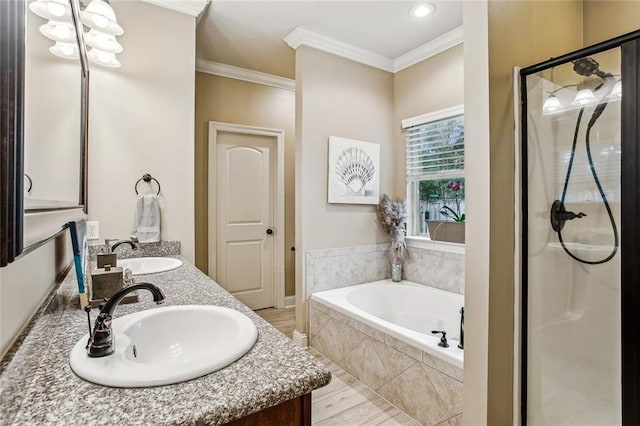 bathroom with ornamental molding, shower with separate bathtub, and vanity