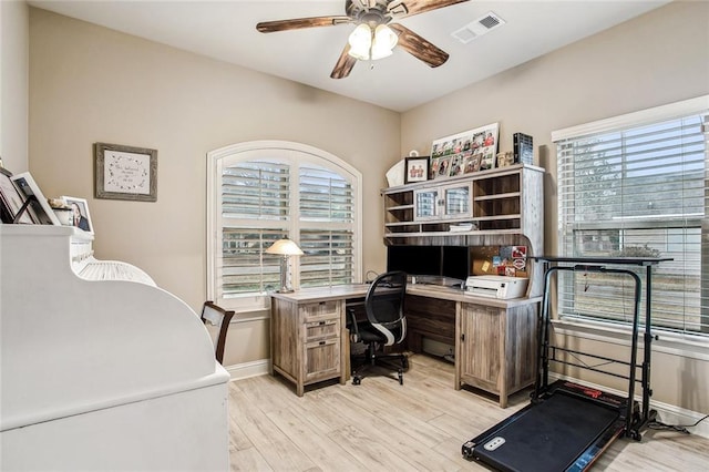 office with ceiling fan and light hardwood / wood-style flooring