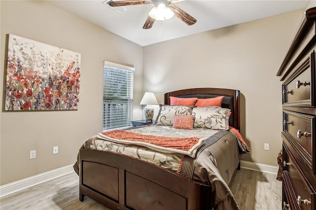 bedroom featuring light hardwood / wood-style floors and ceiling fan