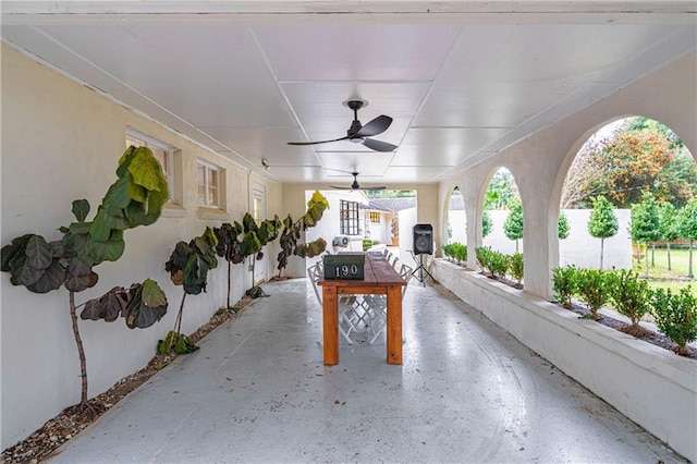 view of patio featuring ceiling fan