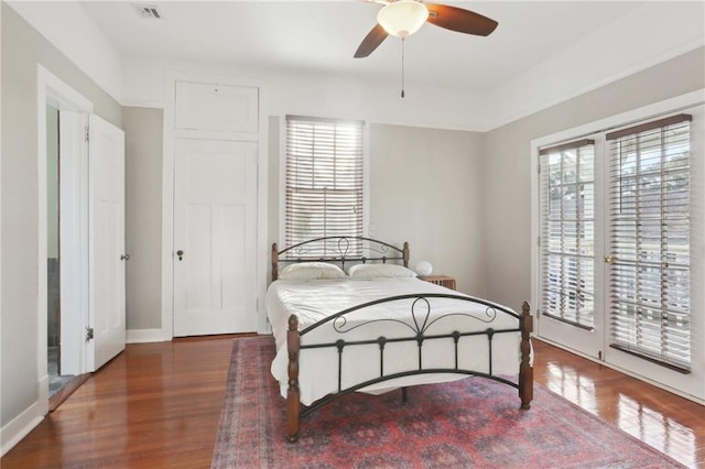 bedroom featuring dark hardwood / wood-style floors and ceiling fan