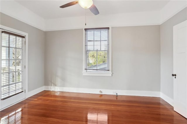 unfurnished room with hardwood / wood-style flooring and ceiling fan