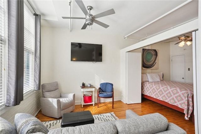 bedroom with hardwood / wood-style floors and ceiling fan