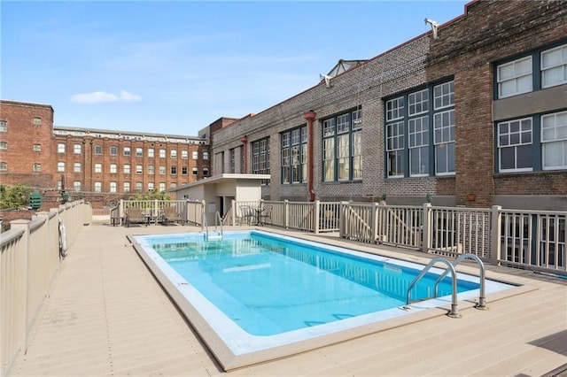 view of swimming pool with a patio