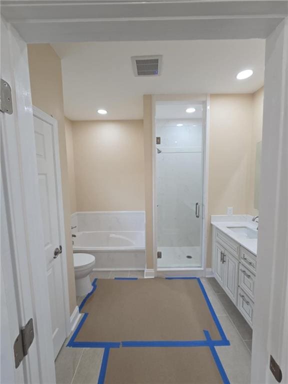 full bathroom featuring vanity, tile patterned floors, toilet, and separate shower and tub