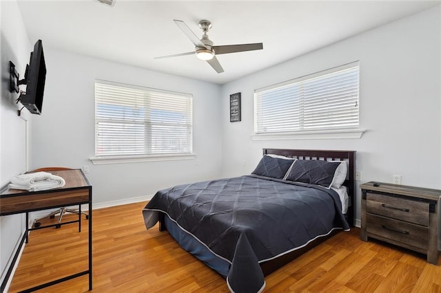 bedroom featuring ceiling fan and light hardwood / wood-style floors