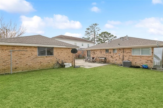 back of property featuring a patio, central AC unit, and a lawn