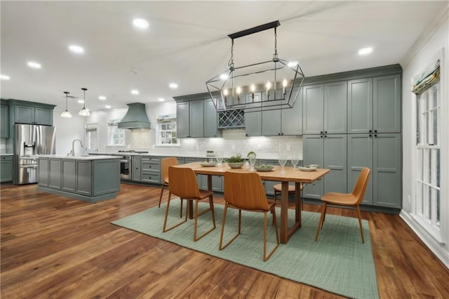 dining room featuring dark hardwood / wood-style flooring and sink