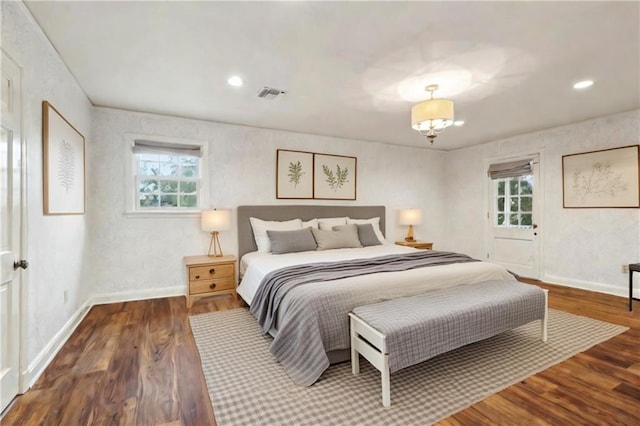 bedroom featuring dark hardwood / wood-style flooring